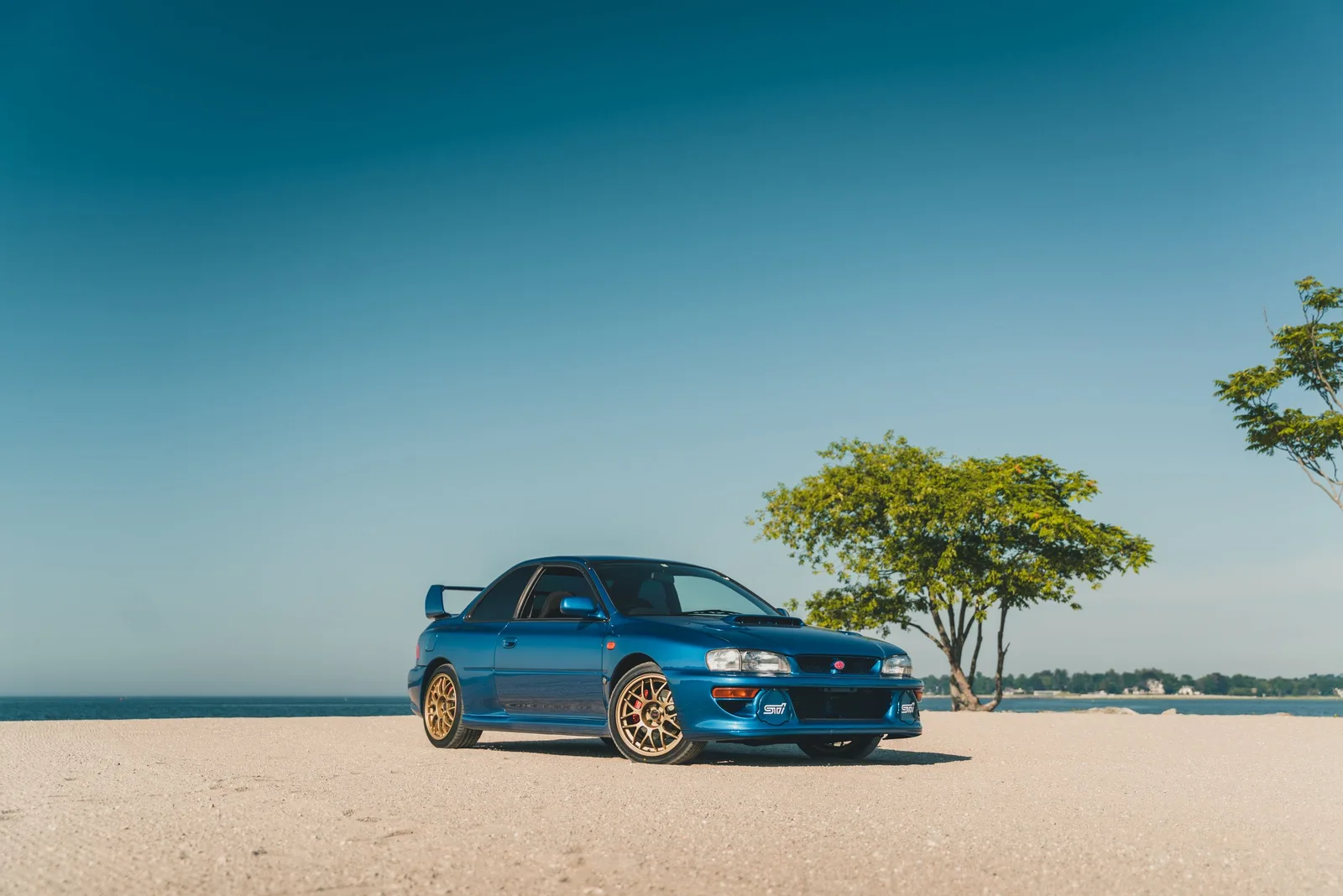 Blue Subaru Impreza 22B STI by the water
