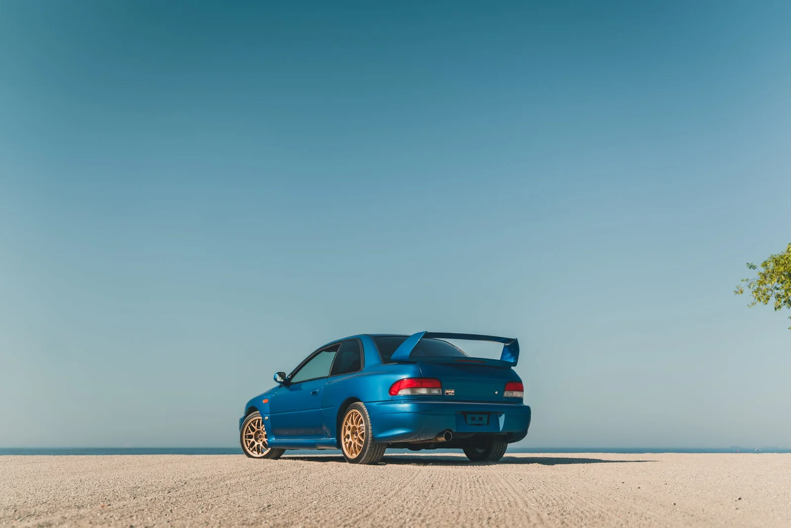Subaru Impreza 22B STI rear three-quarter view by the coast